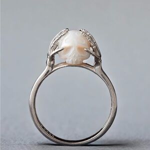 Carved pearl skull ring